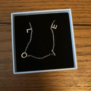Brand new Love necklace never worn